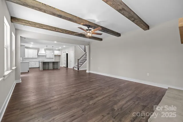 a view of kitchen with furniture and wooden floor
