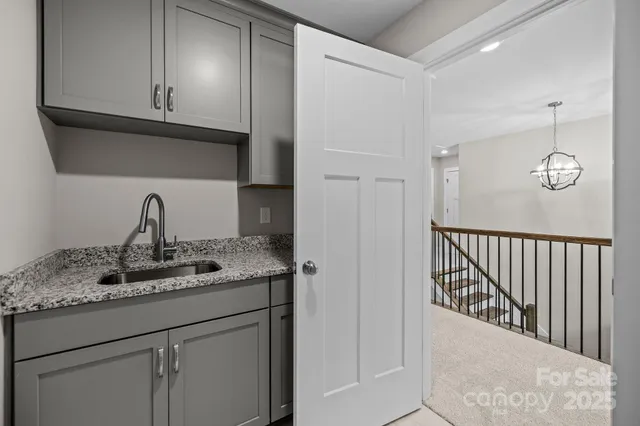 a kitchen with a sink and cabinets