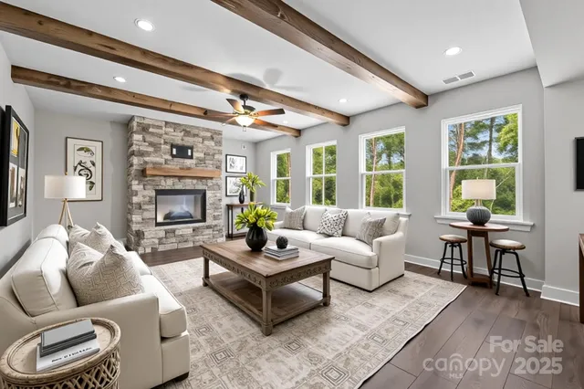 a living room with furniture and a fireplace