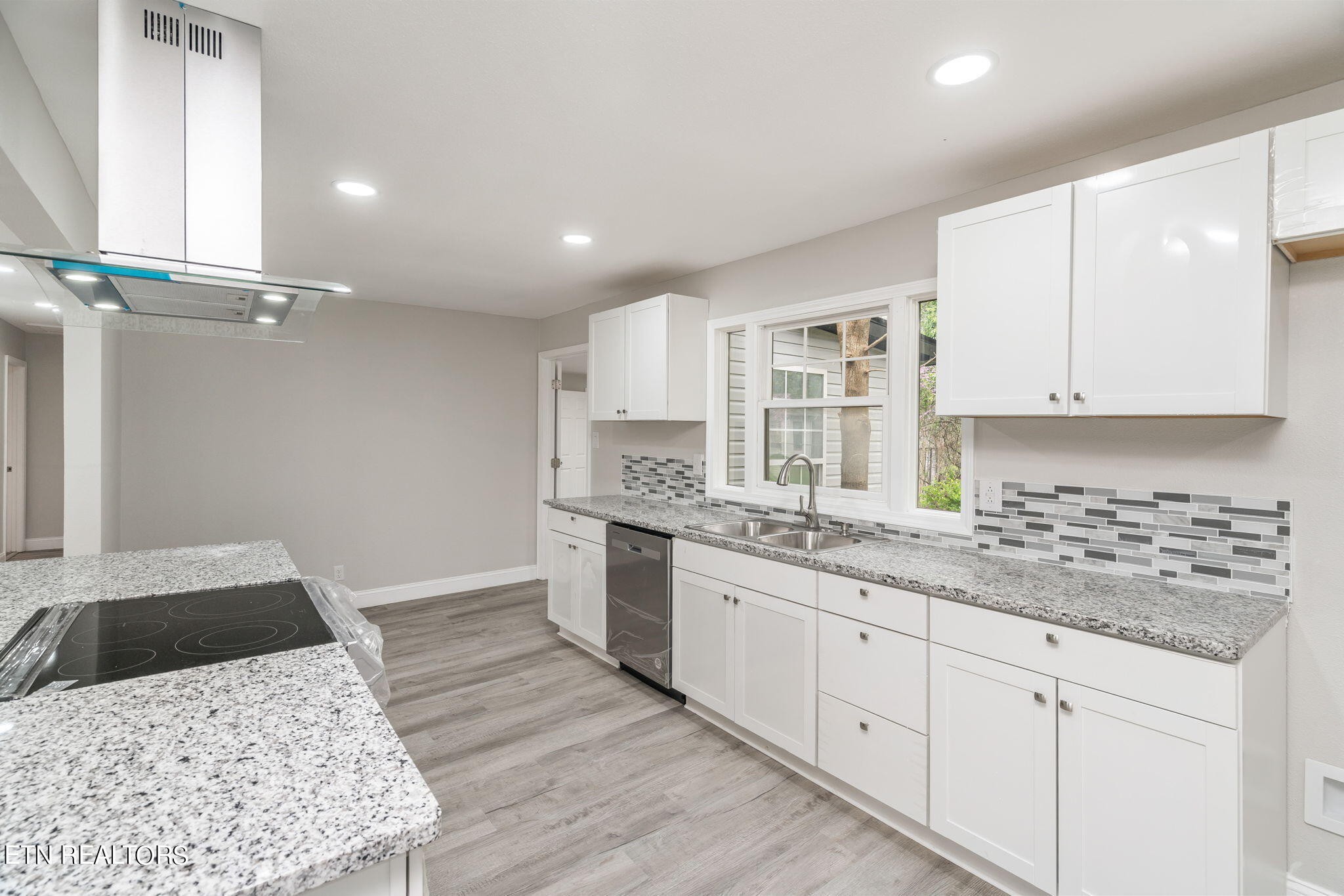 218 Oakmont Road Bean Station, TN 37708 - Photo 11 of 32 a kitchen with a sink stove and cabinets