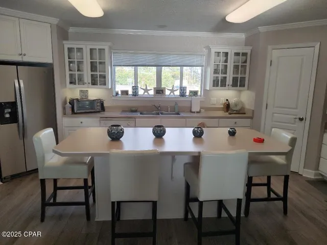 $720,000 | 5833 North Lagoon Drive, Unit A, Panama City Beach, FL 32408