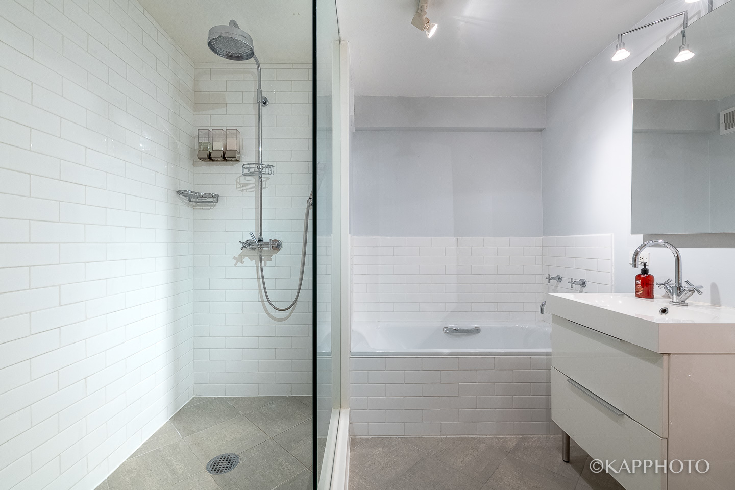 2909 North Sheridan Road, Unit 1807 Chicago, IL 60657 - Photo 14 of 23 a bathroom with a shower sink and mirror