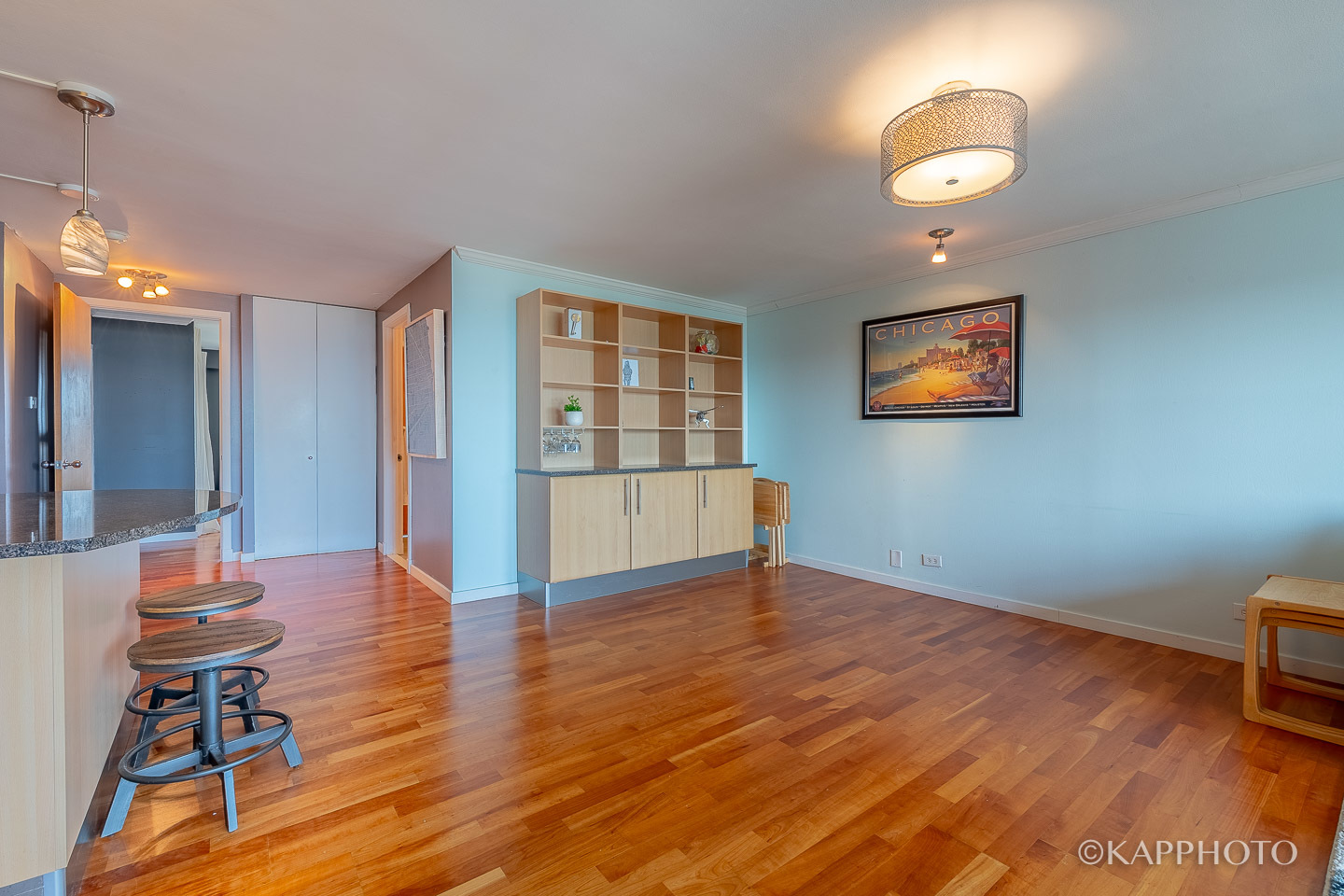 2909 North Sheridan Road, Unit 1807 Chicago, IL 60657 - Photo 18 of 23 a view of livingroom with furniture wooden floor and window
