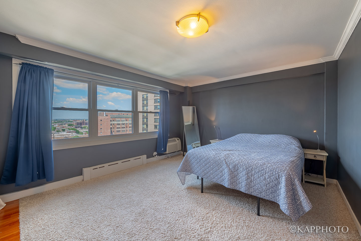 2909 North Sheridan Road, Unit 1807 Chicago, IL 60657 - Photo 7 of 23 a bedroom with a bed and a window