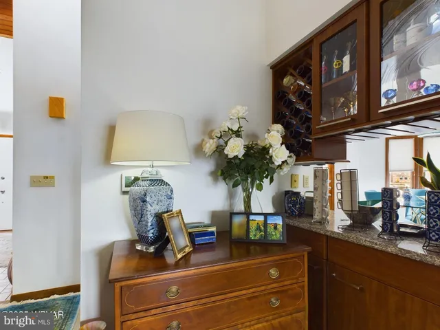 a bedroom with furniture and a flat screen tv