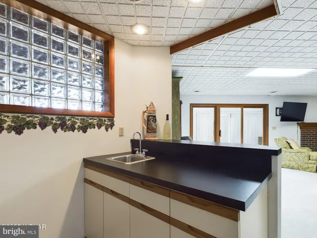 a bathroom with a tub and a sink