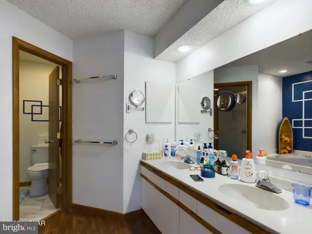 a bedroom with a large bed and a large window