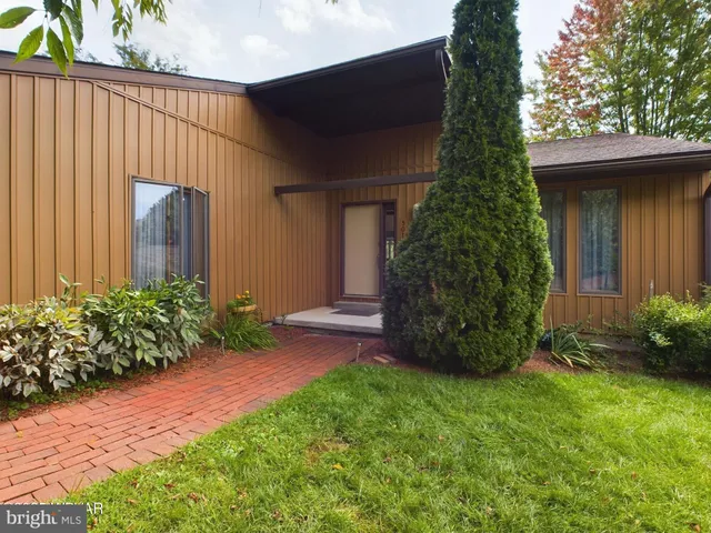 a backyard of a house with lots of green space