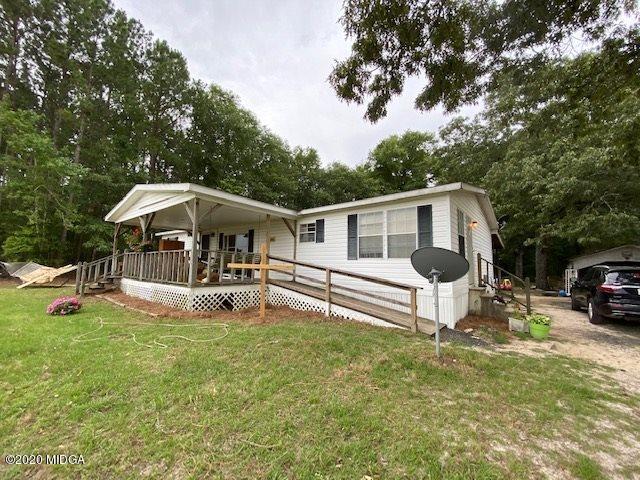 1155 Macedonia Church Road Cochran, GA 31014 - Photo 2 of 22 a view of house and a yard with swimming pool