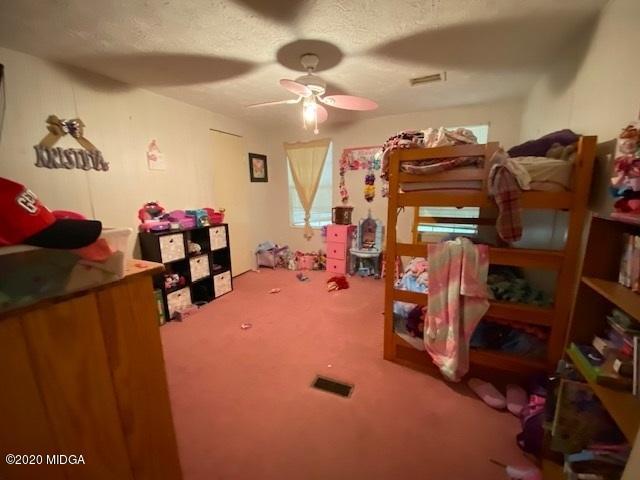 1155 Macedonia Church Road Cochran, GA 31014 - Photo 18 of 22 a view of a room with gym equipment