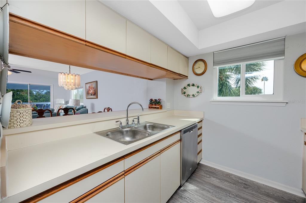 816 Hidden Harbour Drive Indian Rocks Beach, FL 33785 - Photo 11 of 58 a kitchen with a sink and a window