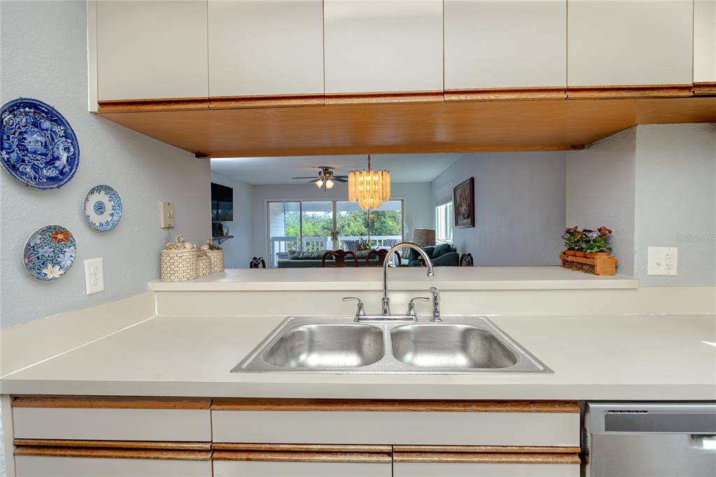 816 Hidden Harbour Drive Indian Rocks Beach, FL 33785 - Photo 12 of 58 a kitchen with a sink and cabinets