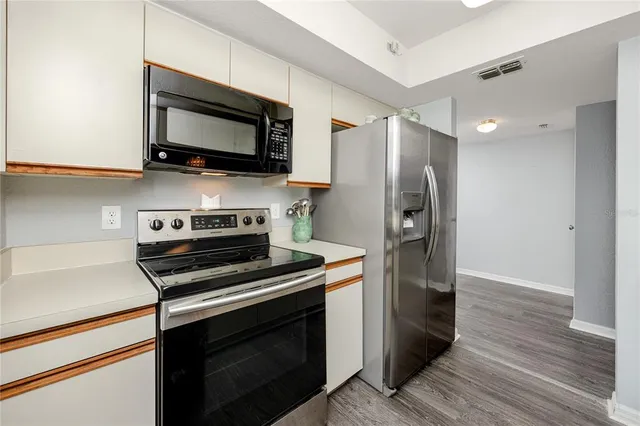 a view of a deck with furniture and wooden floor