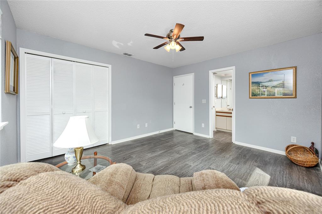 816 Hidden Harbour Drive Indian Rocks Beach, FL 33785 - Photo 19 of 58 a bedroom with a bed and a window