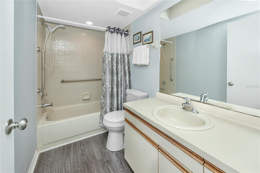 816 Hidden Harbour Drive Indian Rocks Beach, FL 33785 - Photo 25 of 58 a bathroom with a sink toilet and shower