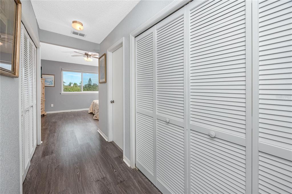 816 Hidden Harbour Drive Indian Rocks Beach, FL 33785 - Photo 26 of 58 a view of a hallway with wooden floor and staircase