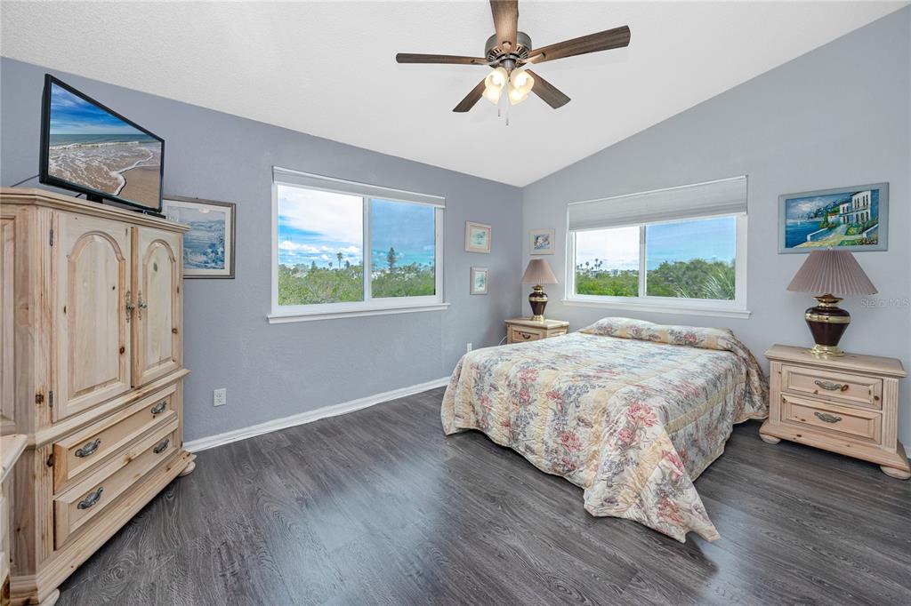 816 Hidden Harbour Drive Indian Rocks Beach, FL 33785 - Photo 28 of 58 a bedroom with a large bed and a window