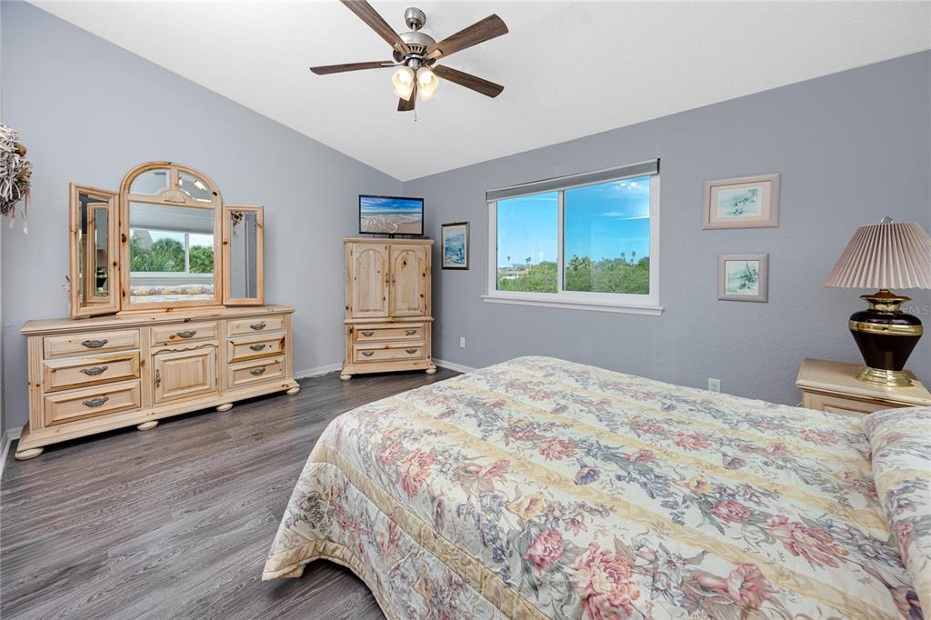 816 Hidden Harbour Drive Indian Rocks Beach, FL 33785 - Photo 29 of 58 a bedroom with a bed and a dresser