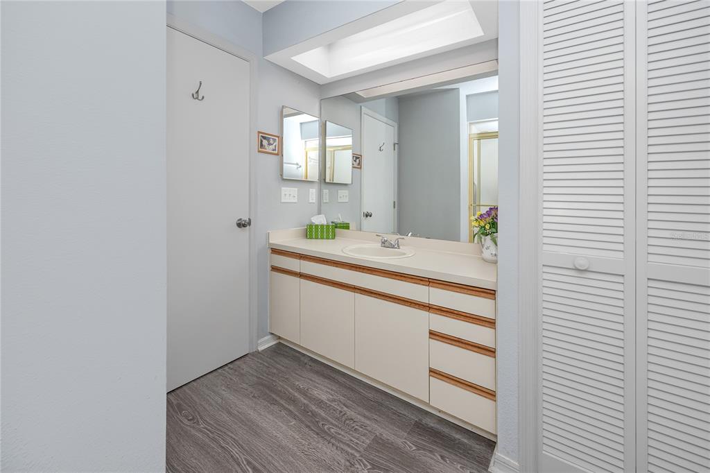 816 Hidden Harbour Drive Indian Rocks Beach, FL 33785 - Photo 32 of 58 a bathroom with a sink and a mirror