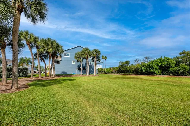 an aerial view of a house with a lake view