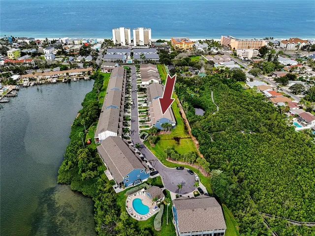 a view of a balcony with wooden chairs