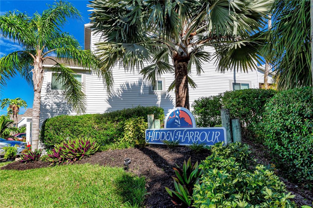 816 Hidden Harbour Drive Indian Rocks Beach, FL 33785 - Photo 46 of 58 a front view of a house with balcony and garden