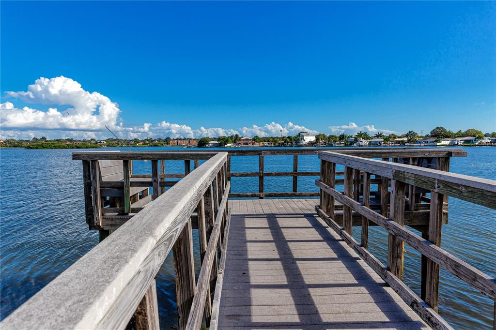 816 Hidden Harbour Drive Indian Rocks Beach, FL 33785 - Photo 52 of 58 a view of a balcony with wooden chairs