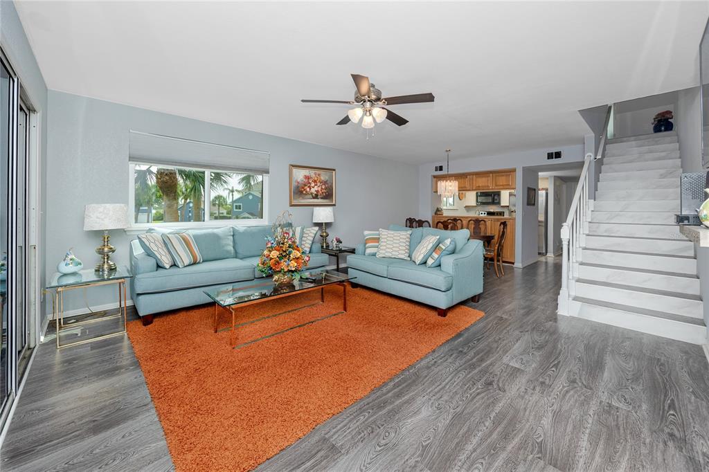 816 Hidden Harbour Drive Indian Rocks Beach, FL 33785 - Photo 8 of 58 a living room with furniture and a wooden floor