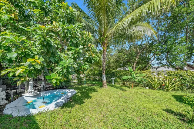 a backyard of a house with lots of green space