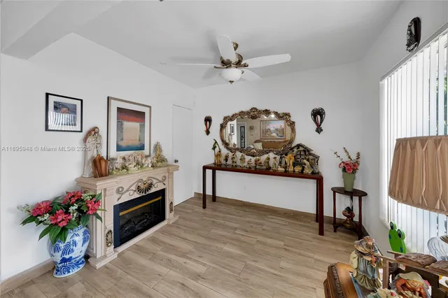 a view of living room with furniture and a fireplace