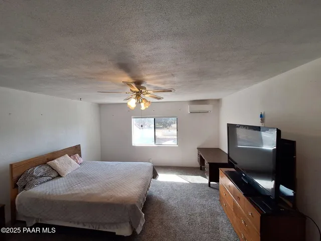 a view of room with wooden floor