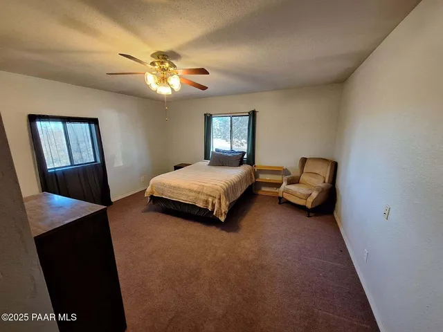 a kitchen with cabinets and wooden floor