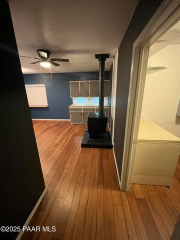 a view of an empty room with windows