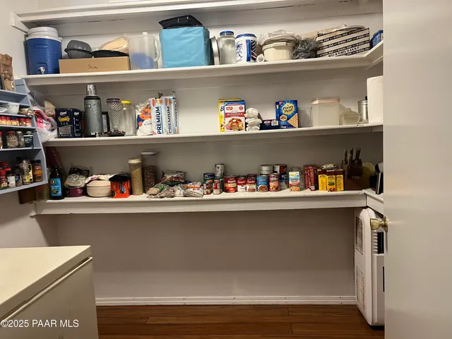 a street view with large trees