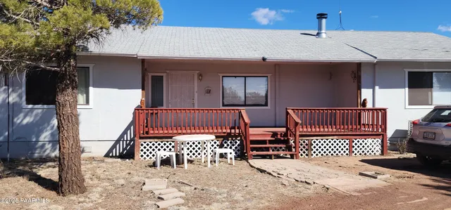 a bed room with a bed and a television