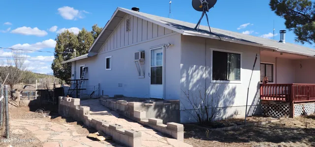 a bed room with a bed mirror and window