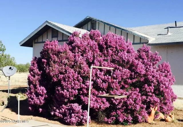 a kitchen with stainless steel appliances granite countertop a sink and a stove