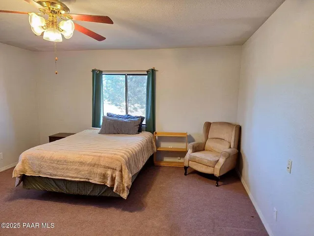 a view of a kitchen with a sink cabinets and wooden floor