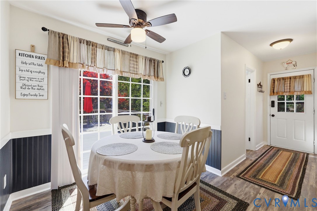 11200 Surry Road Chester, VA 23831 - Photo 19 of 48 a dining room with furniture a rug and window
