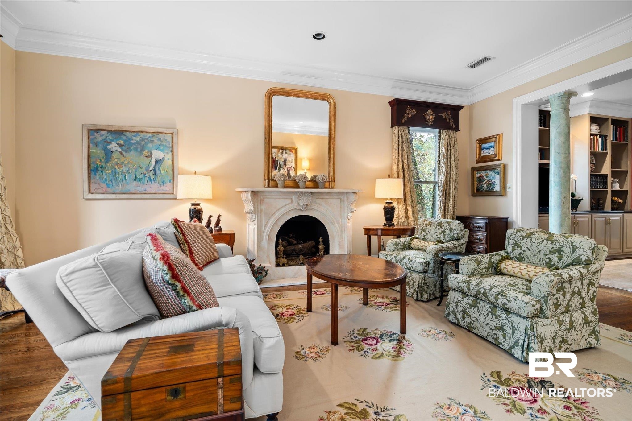354 Dogwood Lane Mobile, AL 36608 - Photo 6 of 44 Living room featuring ornamental molding, a high end fireplace, ornate columns, and wood-type flooring