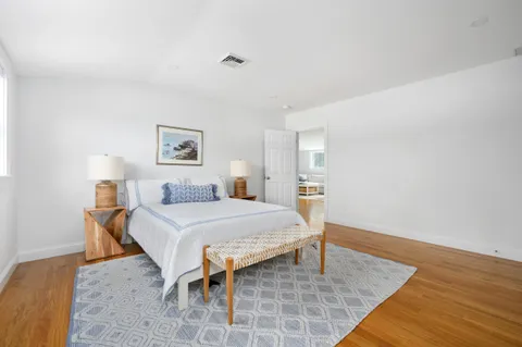 a bed room with a bed and a night stand