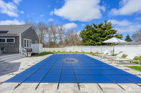 a view of a backyard of the house
