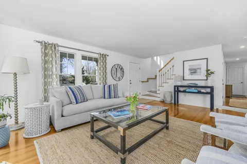 a living room with furniture and a table