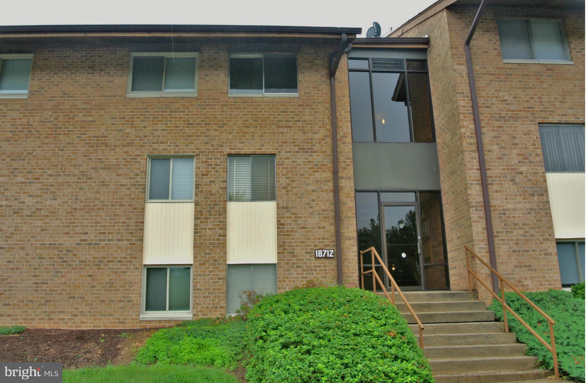18712 Walkers Choice Road, Unit 4 Montgomery Village, MD 20886 - Photo 1 of 15 a front view of a house with stairs