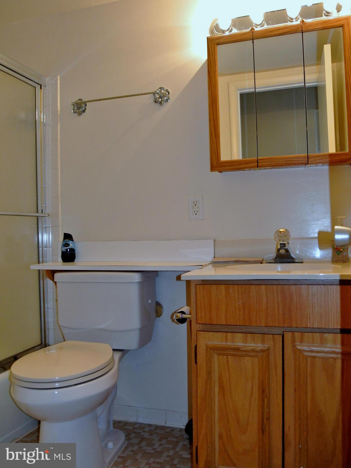 18712 Walkers Choice Road, Unit 4 Montgomery Village, MD 20886 - Photo 11 of 15 a bathroom with a toilet a sink and bathtub