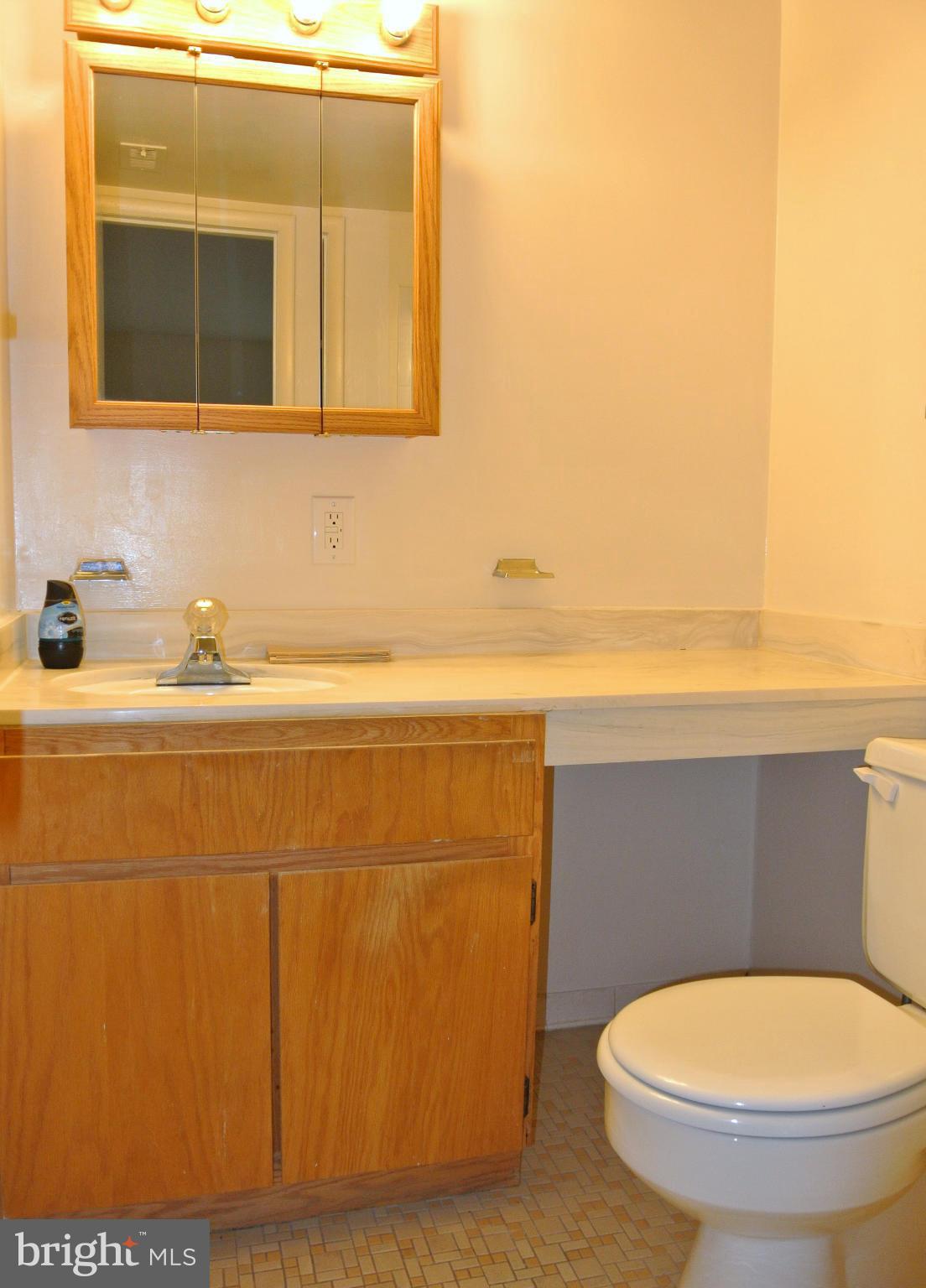 18712 Walkers Choice Road, Unit 4 Montgomery Village, MD 20886 - Photo 15 of 15 a bathroom with a toilet and a sink