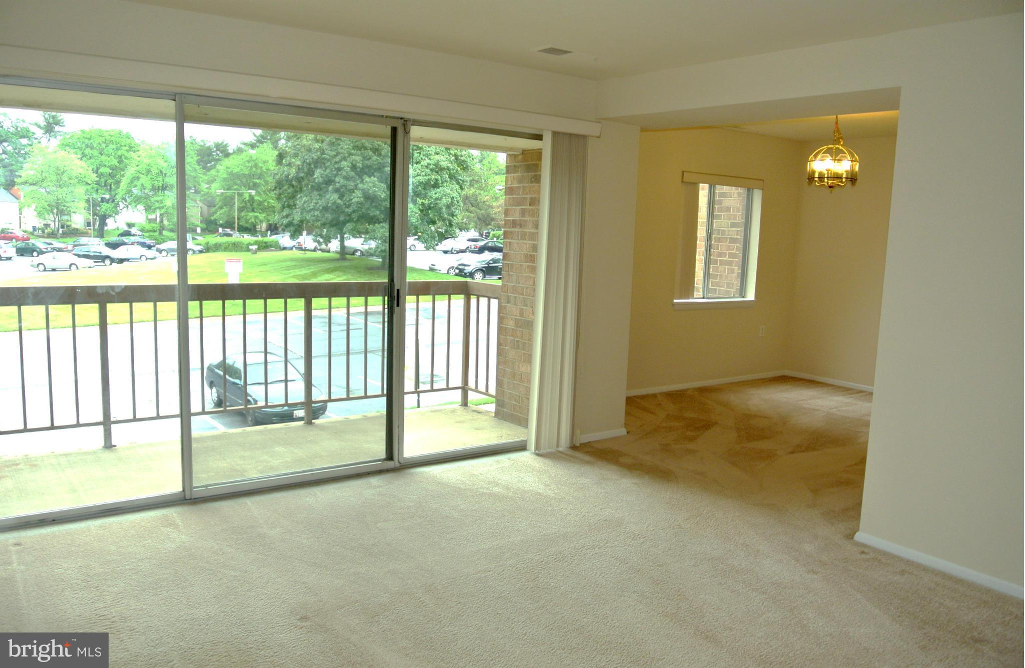 18712 Walkers Choice Road, Unit 4 Montgomery Village, MD 20886 - Photo 5 of 15 a view of an empty room and window