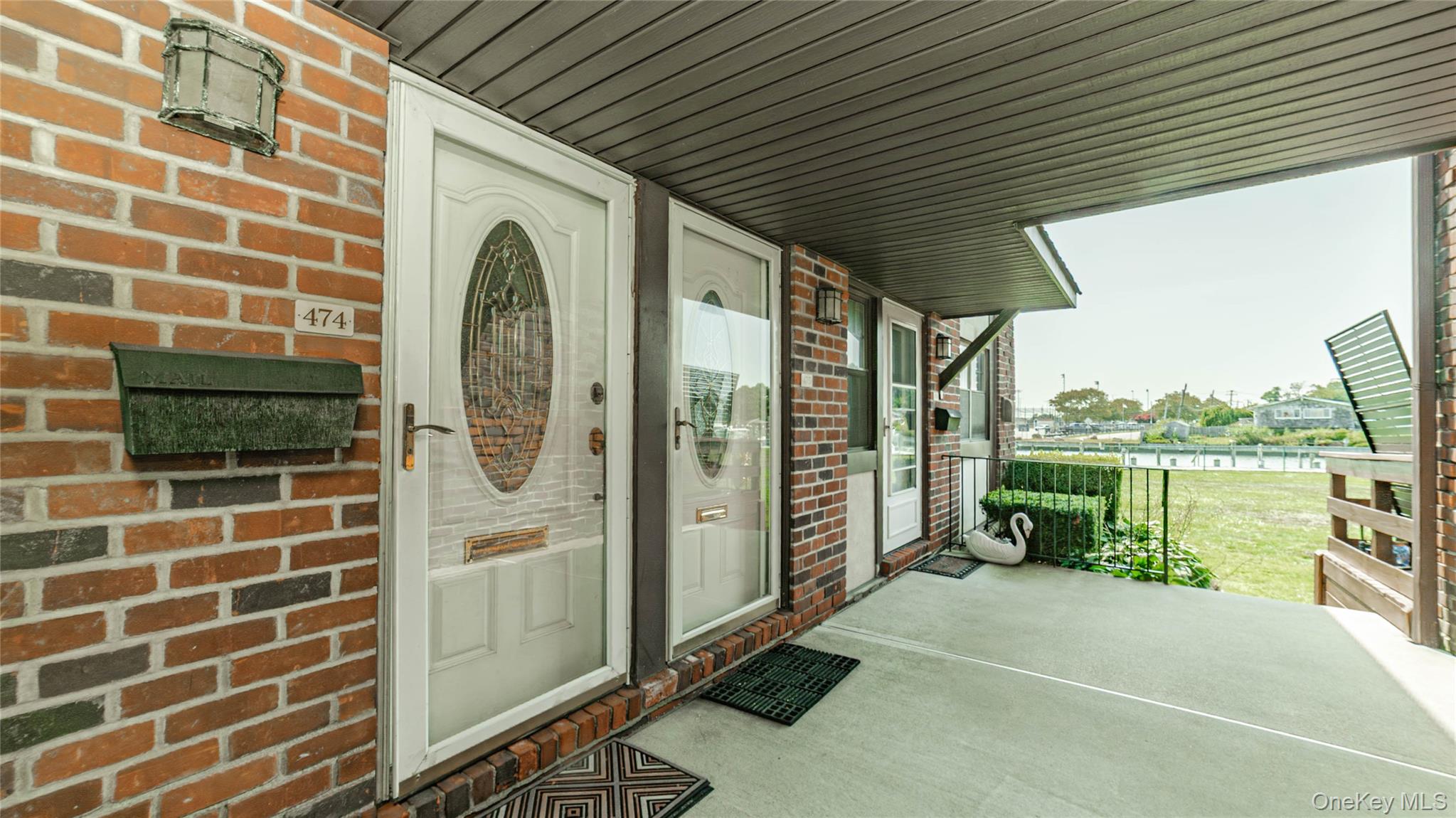 a view of a balcony with a potted plant