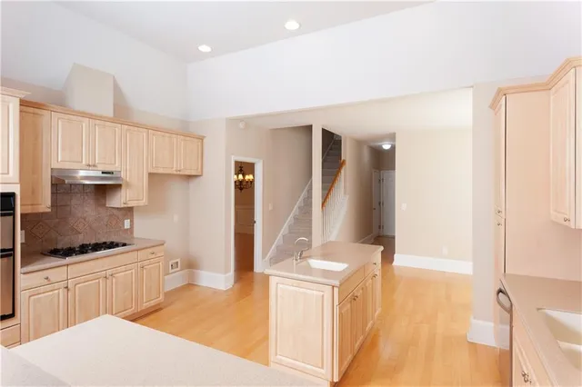 a kitchen with a sink and a refrigerator