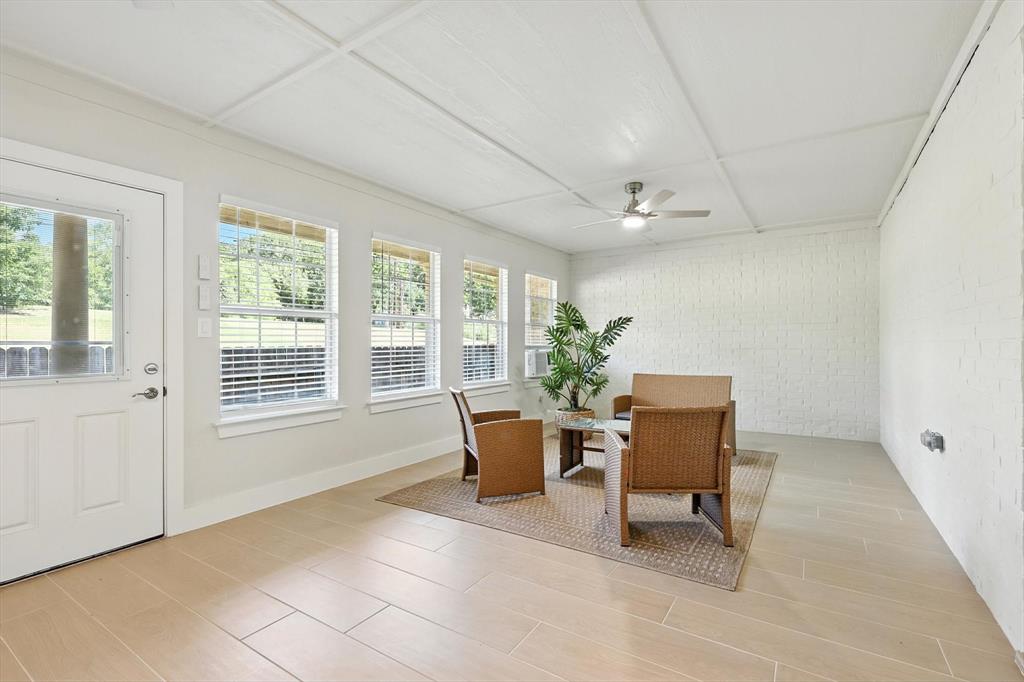3901 Montecito Drive, Unit 1007 Denton, TX 76210 - Photo 16 of 24 a living room with furniture and a window